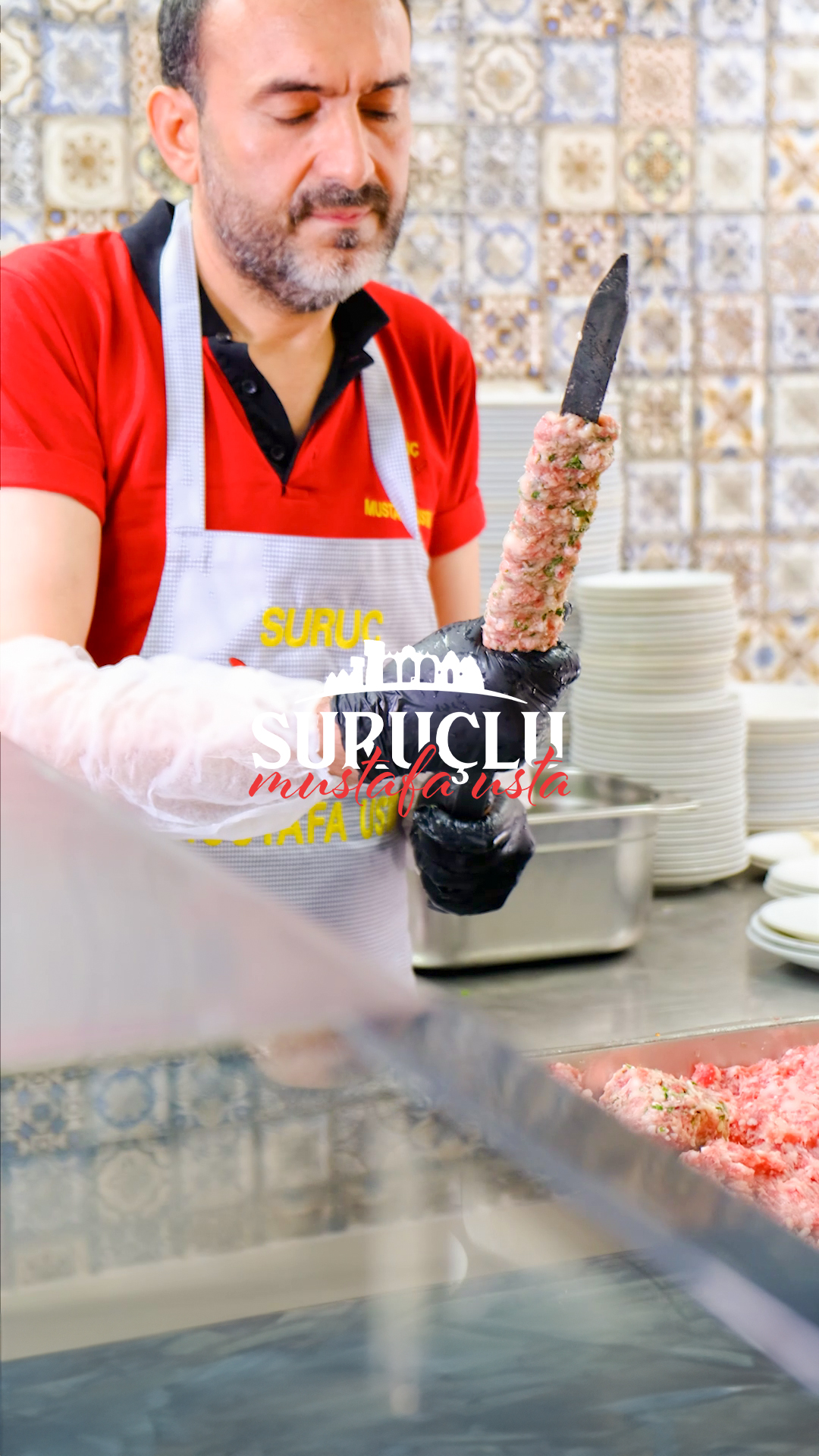 Mustafa Usta hand-shaping kebab